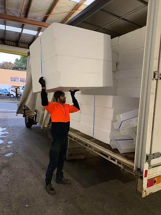 stack of eps foam blocks being put into truck