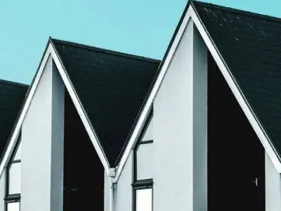 residential-roofing-card.jpg houses in row black tile roofs